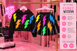 Neon Kisses Lightening Bolt hoodie and sequin skirt displayed on separate hangers; sizes 6 and 14