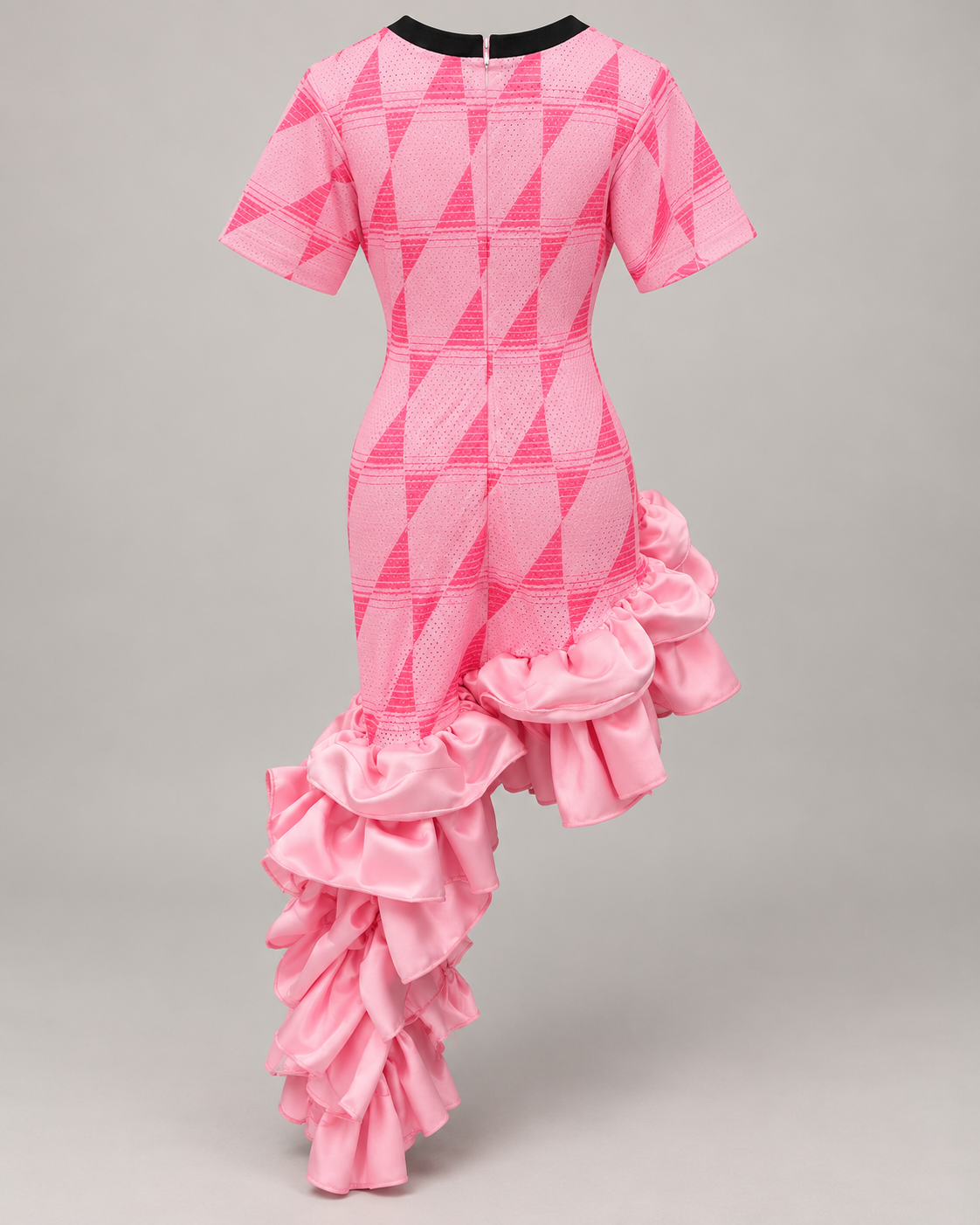 Back view of Pink Encore Mama dress showing the pink geometric print, back zipper and ruffle train.